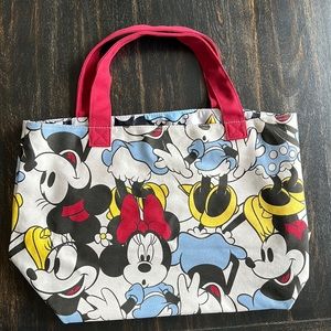 Disney Cream Canvas Tote Bag with one interior pocket. One size. New without Tag